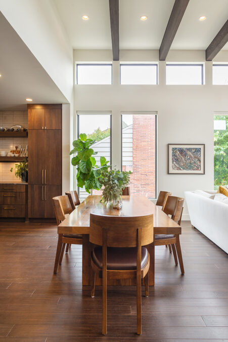 Living Room Table With High Ceiling And Natural Light