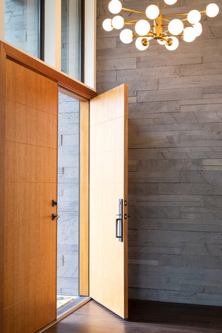 Wood Front Door With Natural Stone Wall